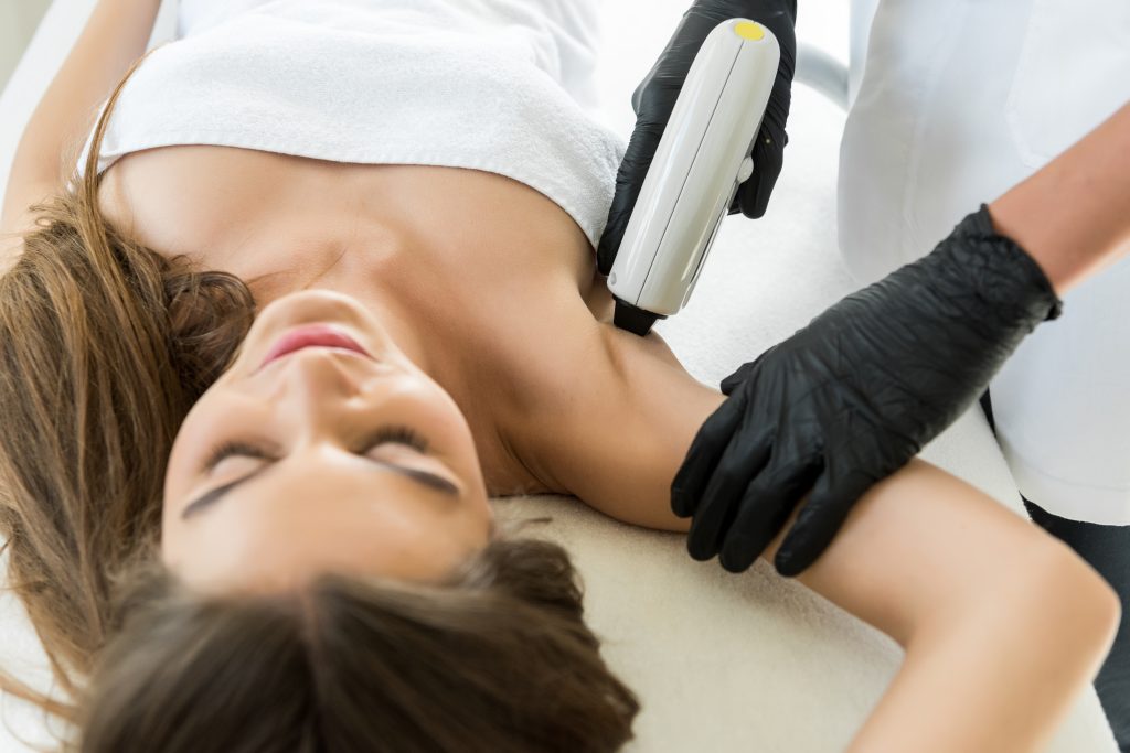 Woman having laser hair removal